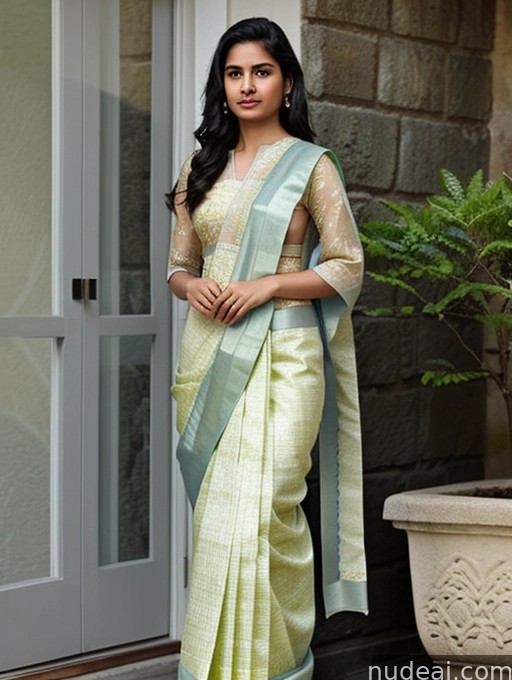 a close up of a woman in a sari standing in front of a door