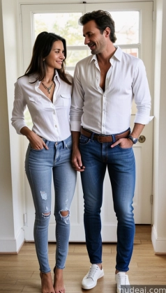 arafed couple in jeans and white shirts standing in a room