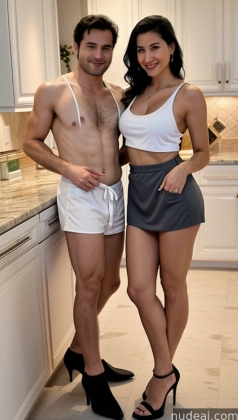 there are two people standing in a kitchen posing for a picture