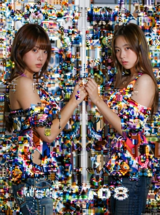 two asian women in colorful dresses standing in front of a mirror