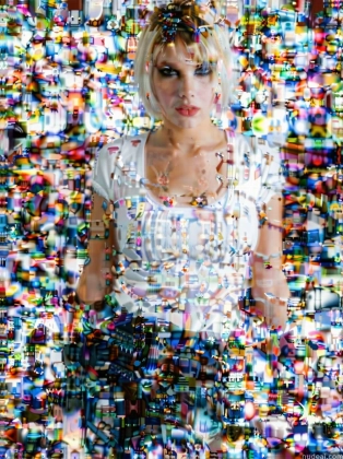 arafed image of a woman standing in front of a wall of colorful objects
