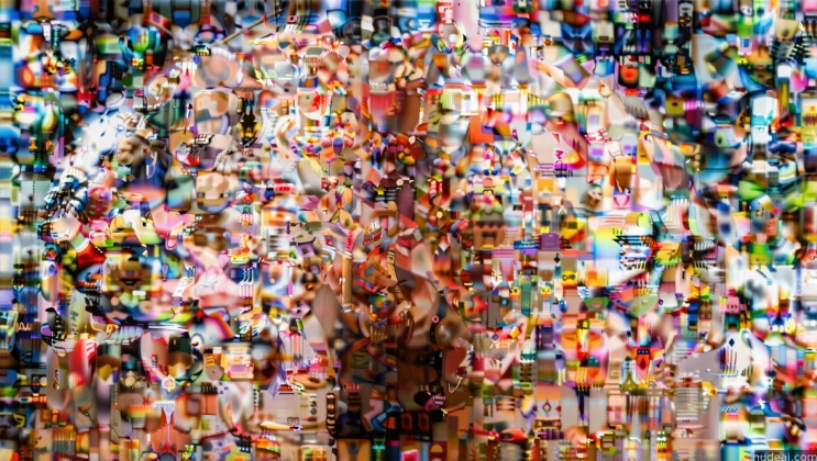 araffes are standing in front of a wall of many different colored objects