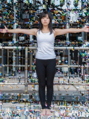 woman standing in front of a wall of bottles with arms outstretched