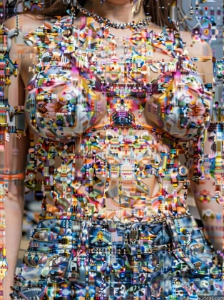 a close up of a woman with a dress made of confetti sprinkles
