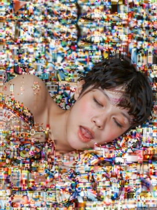 arafed woman laying on a bed of colorful objects