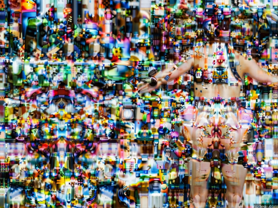 there is a woman standing in front of a wall of toys
